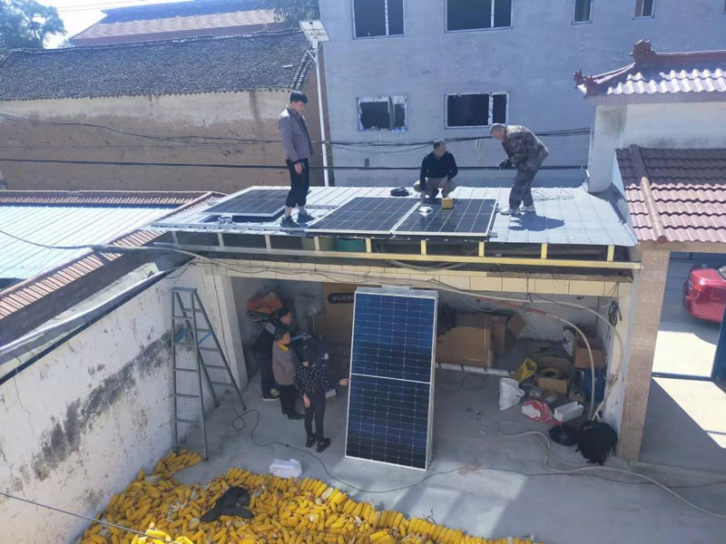 People installing solar panels in China.