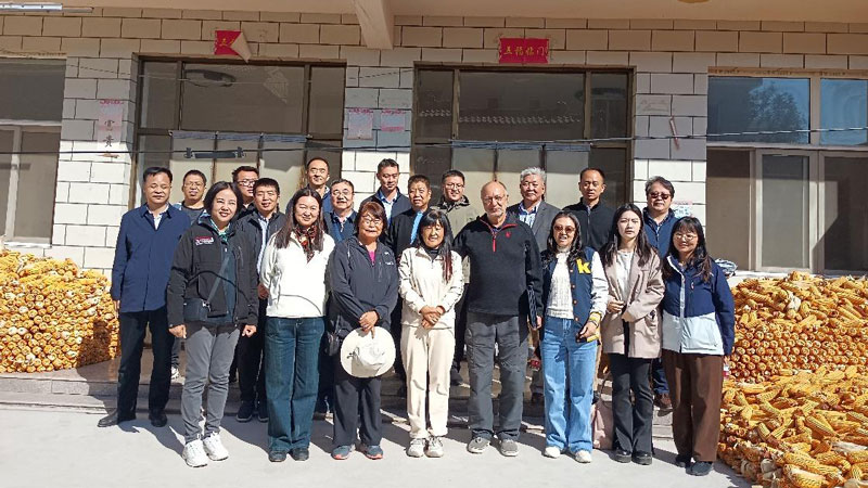 Group of Smart Village members outside of a building in China.
